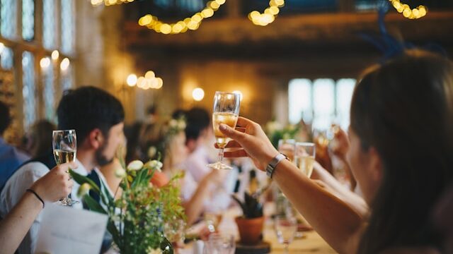 A woman holding a glass